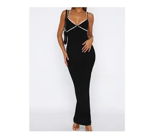 Close-up of the V-neckline with delicate white lace trim on the black Y2K strap dress