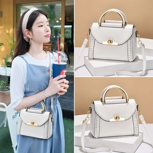 Ivory crossbody bag with metal ring handle and woven side texture detail for women