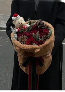 Chic teddy bear plush flower wrap with red roses, pine cones and Christmas hat accent
