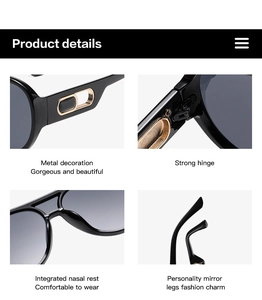Detail view of black oversized sunglasses showing hinges, gold accents, and nose pads