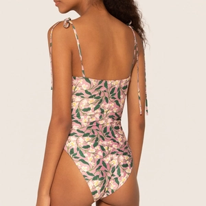 Detailed back view of floral one-piece swimsuit with spaghetti straps and open back