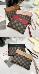 Set of five elegant geometric print clutch purses in various colors with wrist straps