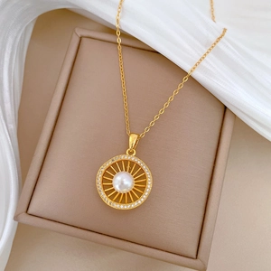 Luxurious gold titanium necklace with pearl pendant and diamond nest design on silk