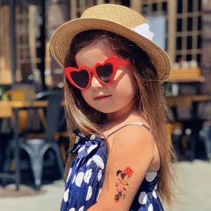 Girl's red heart-shaped sunglasses with dark lenses for outdoor fashion and UV protection