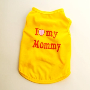 Close-up of yellow dog vest with red I love my Mommy print and pink heart pattern