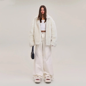 Women's off-white faux fur zip jacket paired with matching wide-leg cargo pants and sandals