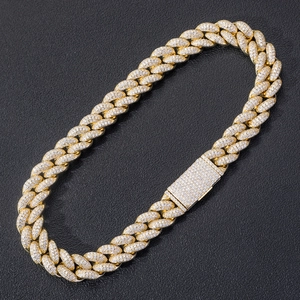 Macro shot of 20mm Miami Cuban link chain with full pave-set zircon stones on black surface
