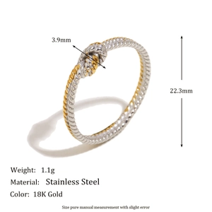 Minimalist twisted knot ring in two-tone 18K gold and silver stainless steel finish