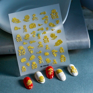 Detailed view of 5D gold embossed rose and lotus nail stickers with metallic texture