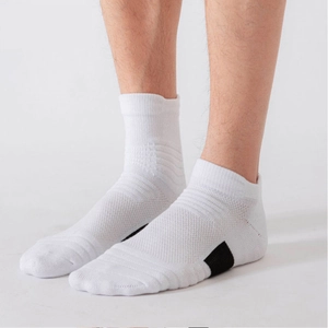 Detailed close-up of white cushioned sports socks with breathable mesh and elastic cuffs