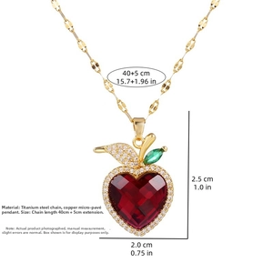 Macro shot of luxury red crystal apple pendant with gold titanium steel chain details