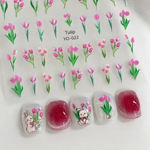 Detailed pink tulip and bunny nail art stickers applied on burgundy gradient nails