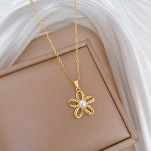 Elegant gold titanium steel necklace featuring a pearl flower pendant with pavé diamonds