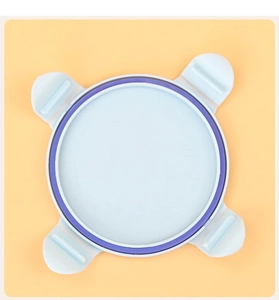 Detailed top view of light blue pet food can lid with purple silicone ring and 4 side clips
