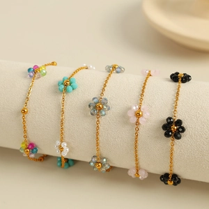 Handmade gold chain bracelet with colorful crystal beaded flowers in pastel colors