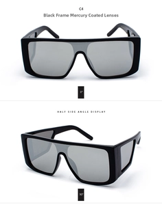 Detail view of oversized black sunglasses with silver mirrored lenses and side shields