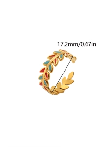 Detail view of 18k gold leaf ring with red and blue enamel and 17.2mm inner diameter