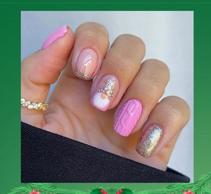 Detail of Christmas press-on nails featuring pink tones, glitter, and 3D sweater textures