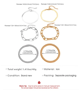 Detailed view of mixed gold and silver link chain bracelet set with size specifications