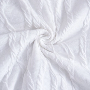Close-up of white cable-knit fabric texture on striped square neck backless maxi dress