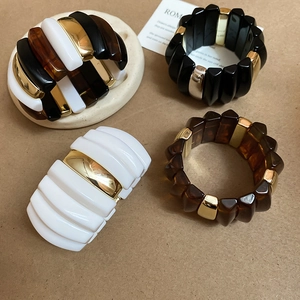 Chunky acrylic bangles in tortoiseshell and solid tones with gold metal spacer beads