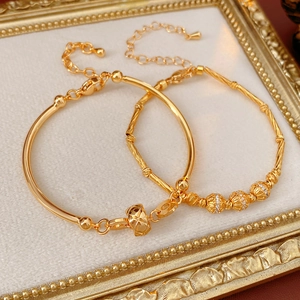 Detailed shot of 18K gold plated bamboo link bracelet with adjustable lobster clasp