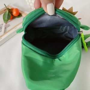 Green dinosaur nylon crossbody bag for kids with spacious interior compartment and zipper