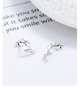Macro shot of silver tulip stud earrings featuring S925 hallmark and sparkling zircon stones