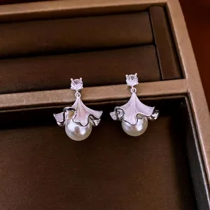 Elegant ginkgo leaf pearl drop earrings with cubic zirconia in a jewelry box