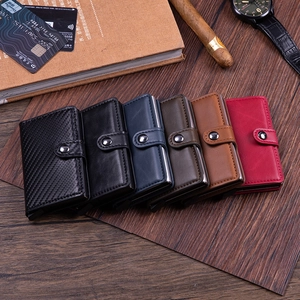 Business RFID blocking card holder wallet set in multiple colors on a wooden desk