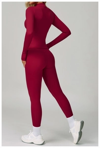 Detail view of burgundy tight fitness jacket and yoga pants with slim fit shaping design