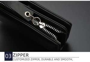 Macro shot of customized silver zipper on a black vintage leather wallet for men