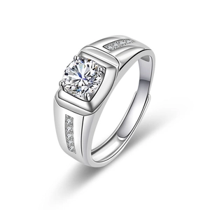 Detail of men's silver ring with round brilliant cut zircon and pave side diamonds