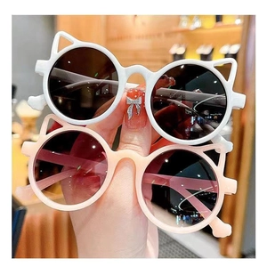 Detail showing cute cat ear sunglasses for kids in stylish white and peach frames