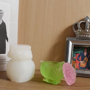 Detail of DIY berry flower silicone mold with green leaf jar and pink petal lid