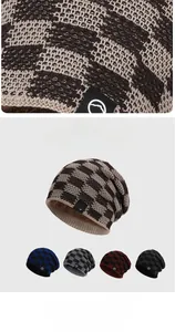 Detail of warm winter knit hat showing thick fleece lining and textured grid pattern