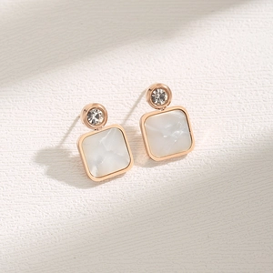 Square shell stud earrings in rose gold with marble texture and small sparkling crystals