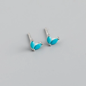 Detailed view of sterling silver leaf-shaped earrings with marquise turquoise stones