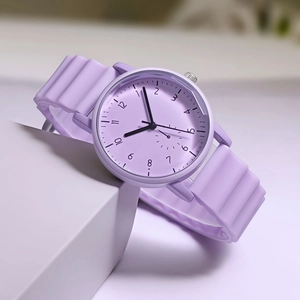 Detailed close-up of lavender silicone watch band with stylish wavy texture and round dial