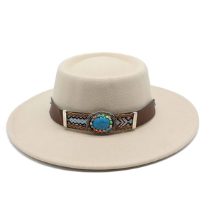 Close-up of bohemian style hat band with turquoise buckle on beige flat brim hat