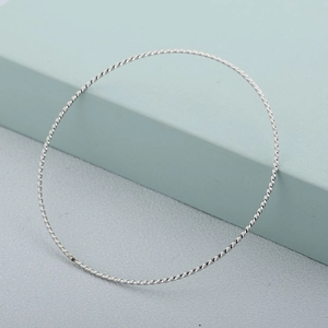 Sleek 65mm silver stainless steel twisted cable ring bracelet with a minimalist finish