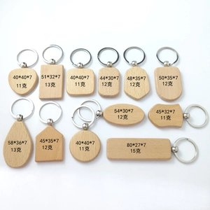 Various geometric beech wood keychains in multiple shapes on a clean white background