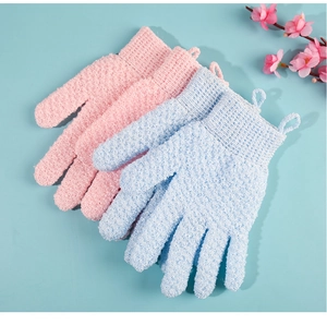 Close-up of pink and blue exfoliating bath gloves showing textured scrubbing fabric