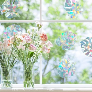 Rainbow prism window stickers featuring monstera leaf shapes for holographic sun catching