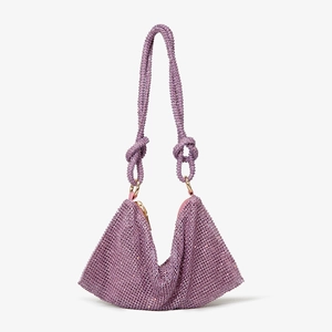 Macro view of purple rhinestone handbag showing knot details and sparkling texture
