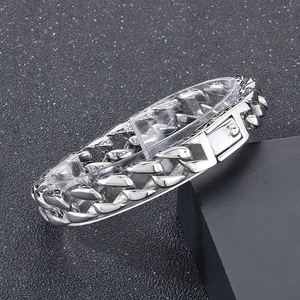 Detailed view of silver stainless steel 11mm Cuban link bracelet with square buckle
