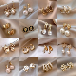 Elegant S925 silver pearl earring collection with vintage gold finish and diverse designs