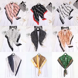 Collage of nine satin square scarves with geometric patterns and diverse animal prints