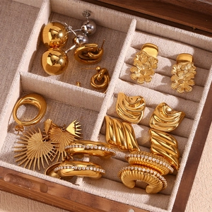Assorted 18K gold and silver plated irregular geometric earrings in a wooden jewelry box
