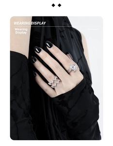 Detail view of wavy hollow S925 silver rings with diamonds shown on model hand